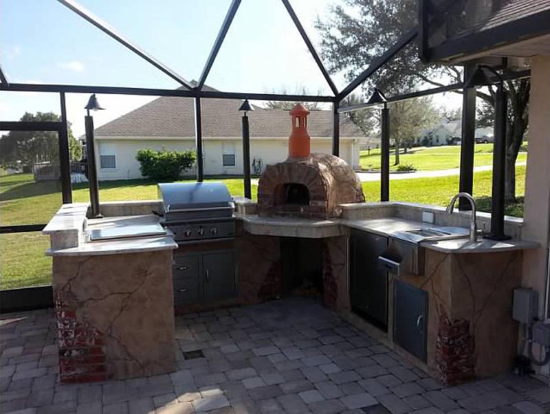 outdoor kitchen with wood pizza oven