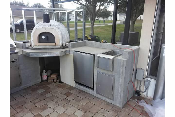 outdoor kitchen with wood pizza oven